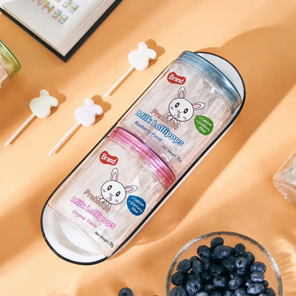 Milk lollipops stacked jars and blueberries